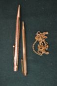 Two gilt metal propelling pencils and other items.