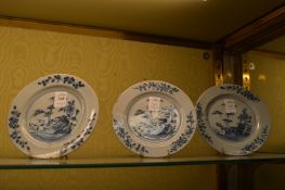 A set of three Chinese blue and white small plates, chipped, cracked and repaired.