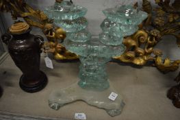 An unusual glass sculptural stand.