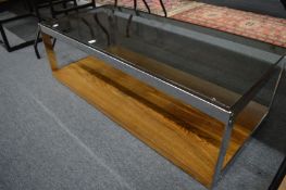 A stylish glass top, chrome framed and rosewood rectangular coffee table.