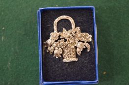 A silver and marcasite brooch modelled as a basket of flowers.