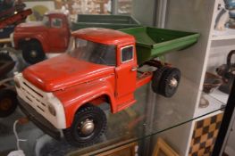 A tin plate tipper truck.