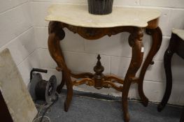 A pair of rosewood and marble top serpentine shaped console tables.