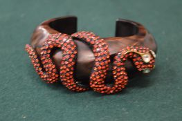 Decorative bangle with snake design.