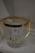 Cut glass ice bucket with gilt metal mounts.