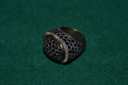 A heavy silver and diamante ring.