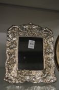 An ornate silver photograph frame.