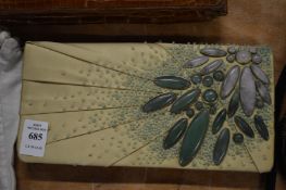 A silk clutch bag with hard stone decoration.