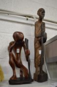 Two carved wood figures.