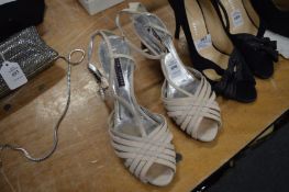 A pair of Ralph Lauren shoes, size unknown.