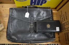 A small box and a leather briefcase.