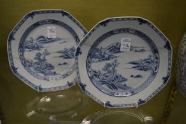 A pair of Chinese hexagonal shaped blue and white plates, one cracked and chipped.