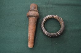 A veined marble bracelet and a wooden item.