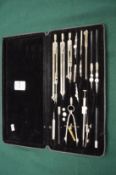 Cased set of drawing instruments.