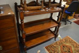A Victorian walnut three-tier buffet.