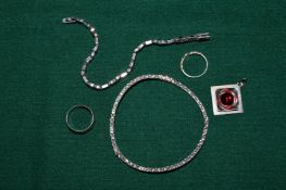 Five pieces of silver jewellery.