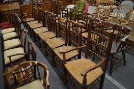 A good set of eight 19th century rush seated Lancashire spindle back dining chairs, two with arms.