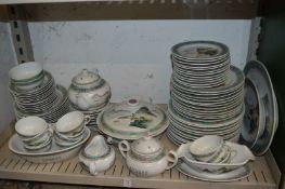 A comprehensive Chinese dinner service painted with landscape scene.