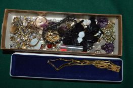 A Gucci box containing costume jewellery.