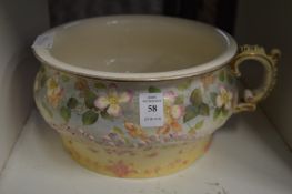 A floral decorated chamber pot.