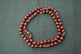 A Kenneth Lane bead necklace.