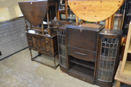 An oak bureau/display cabinet together with an oak drop-leaf table and small sideboard.