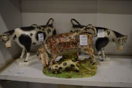A good pair of Staffordshire cow creamers together with a bull baiting group.