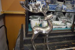 An aluminium tea light holder in the form of a stag.