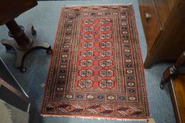 A small Bokhara rug, 124cm x 80cm.