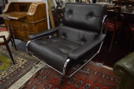 A stylish chrome framed and black leather upholstered swivel armchair.