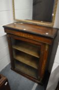 A Victorian inlaid walnut pier cabinet.