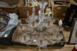 An ornate two-tier twelve light chandelier.