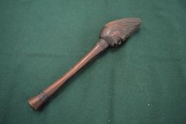 A small African carved wood club.