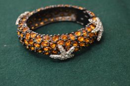 A diamante star set bangle.