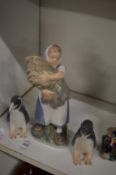 Copenhagen figure of a girls holding a sheaf of corn together with a pair of penguins, one beak