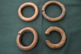 Four African brass bracelets.