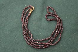 A small garnet necklace.