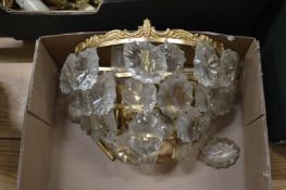 An ormolu and cut glass wall light fitting.