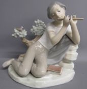 Lladro 'Flutist Student' 14837 boy playing flute - approx. 20cm x 19cm x 15cm