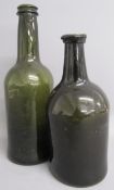 2 green glass wine / spirit bottles - 28cm tall and 23cm tall