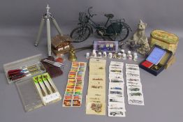 Selection of items including green metal model bike, Wolf sculpture of a beaver and a duck, Quarry