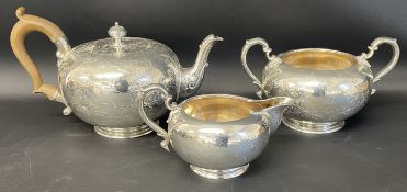 Victorian three piece silver tea set comprising teapot, sugar bowl & milk jug. 42ozt, by Garrard