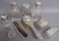 10 1900's silver topped dressing table pieces includes scent bottles, pots, hairbrush and comb