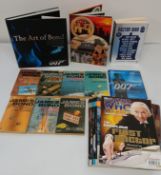 7 x James Bond Pan paperback novels, folder of 007 Spy Cards, 