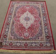 Rich red ground full pile Kashmir rug, floral medallion design 190cm x 140cm
