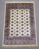 Ivory ground full pile Kashmir rug with traditional Bokhara design - approx. 170cm x 120cm