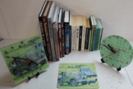 Selection of books, two battery operated glass clocks depicting Land Rover & Dogs (untested) Land