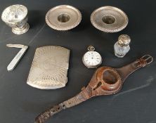 Small silver footed cup Birmingham 1906, pair of silver candelabra drip collars, silver cigarette