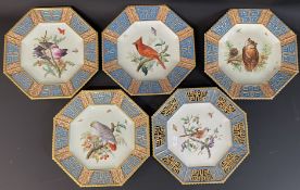 Set of four late Victorian octagonal plates with central bird design & blind fretwork borders with