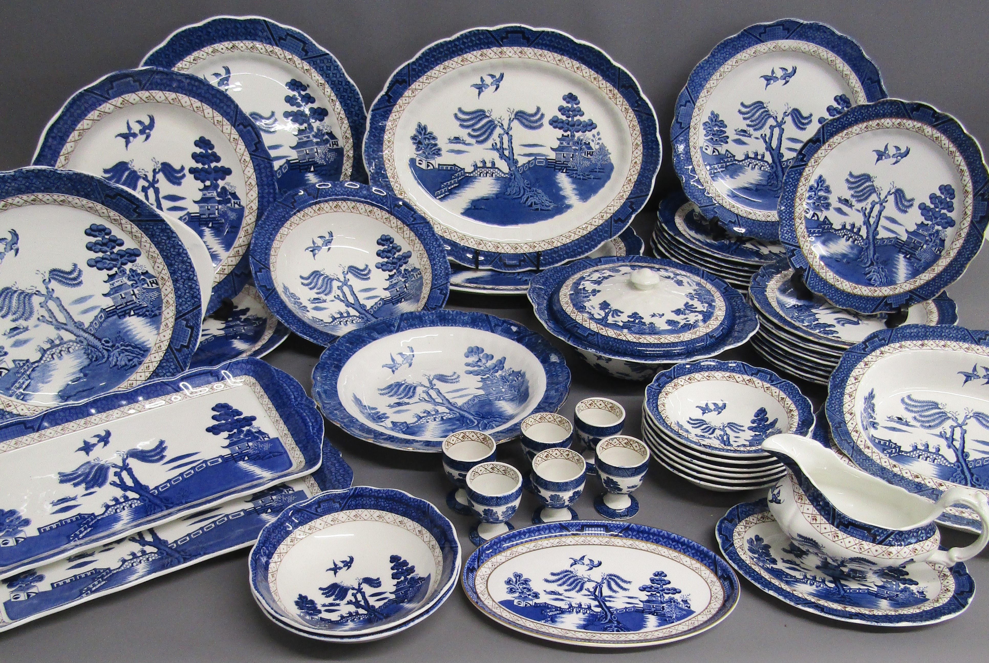 Booths Old Willow table ware includes plates, tureen, gravy boat and saucer, bowls, egg cups etc